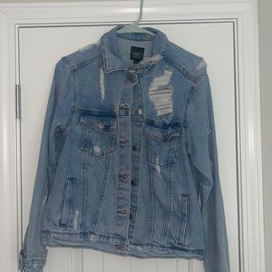 Denim Jacket with Rips in it.